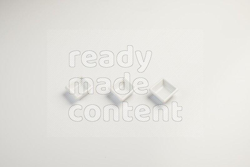 white ceramic square sauce dish on white countertop