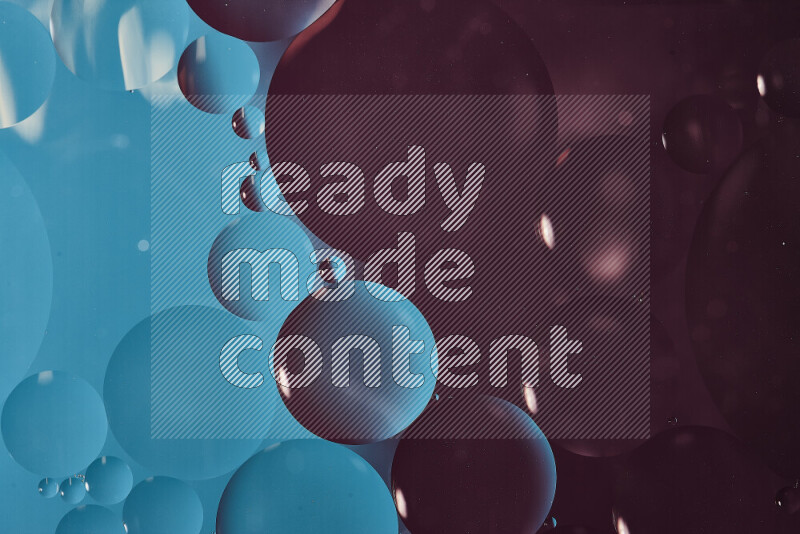 Close-ups of abstract oil bubbles on water surface in shades of blue and purple