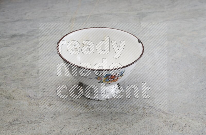 A vintage metal pot on grey marble background