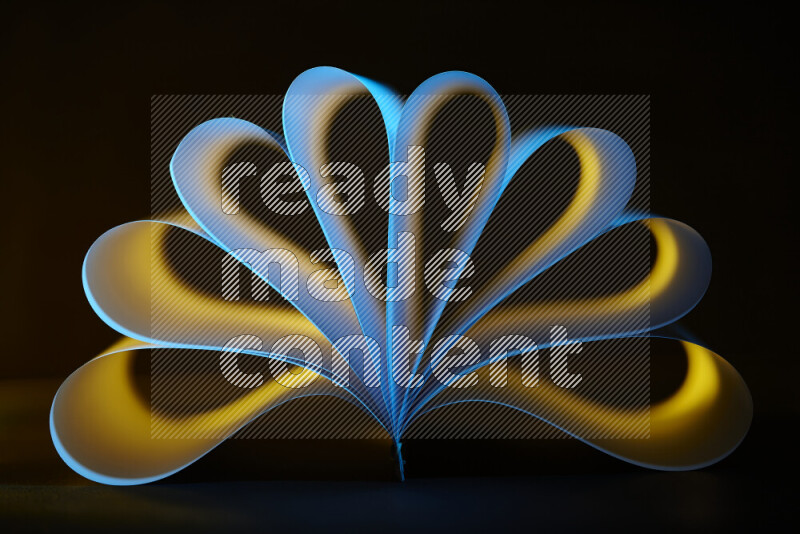 An abstract art piece displaying smooth curves in yellow and blue gradients created by colored light