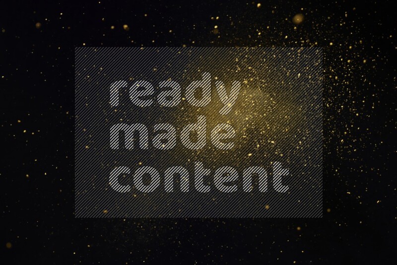 Yellow powder explosion on black background