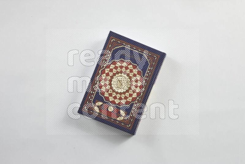 Quran with a prayer beads on white background