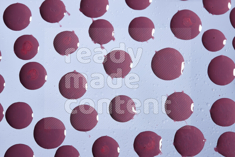 Close-ups of abstract purple paint droplets on the surface