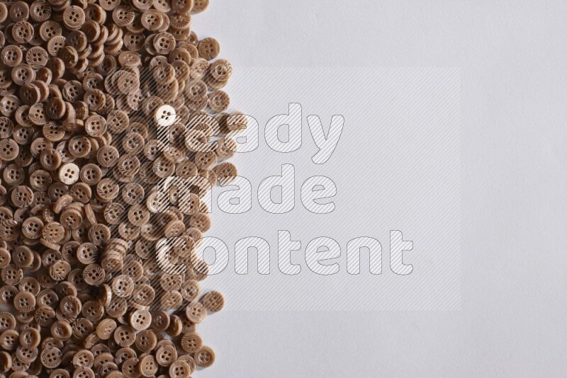 Brown buttons placed on grey background