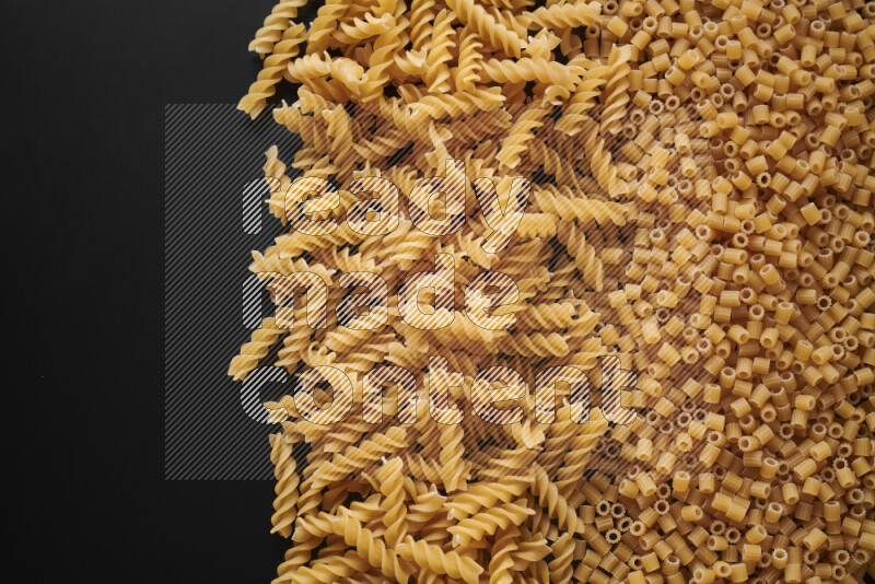 Different pasta types on black background