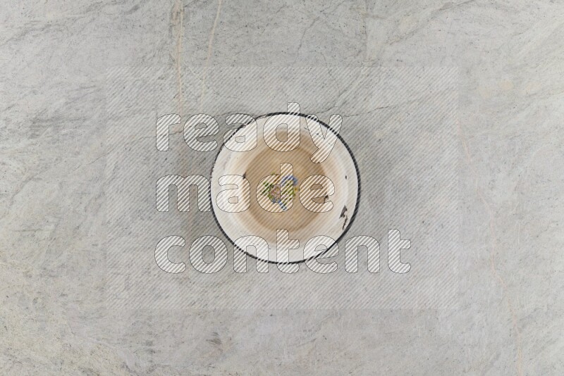 A vintage metal plate on grey marble background