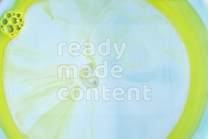 A close-up of abstract swirling patterns in green gradients