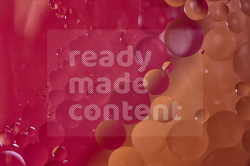 Close-ups of abstract oil bubbles on water surface in shades of red and orange