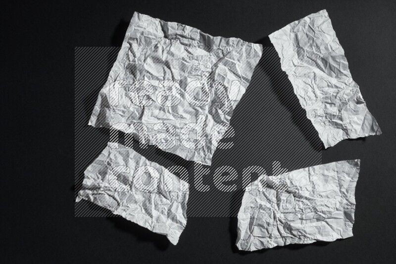 White paper sheet on black background