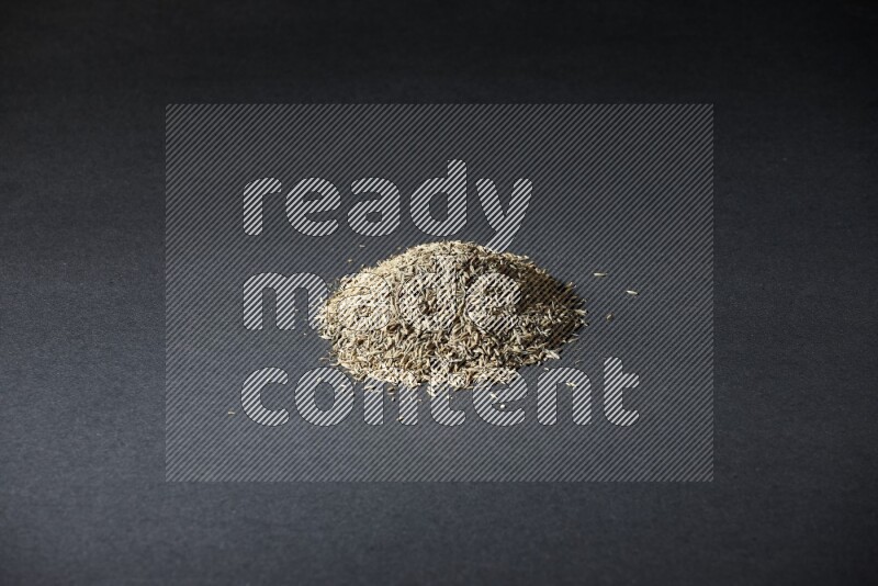 حبوب الكمون علي خلفية سوداء