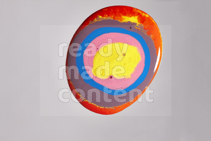 Close-ups of assorted colors blending on a grey background