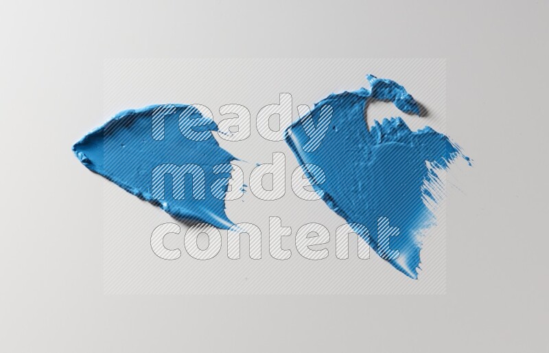 Blue painting knife strokes on white background