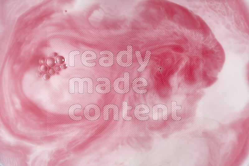 A close-up of abstract swirling patterns in red and white