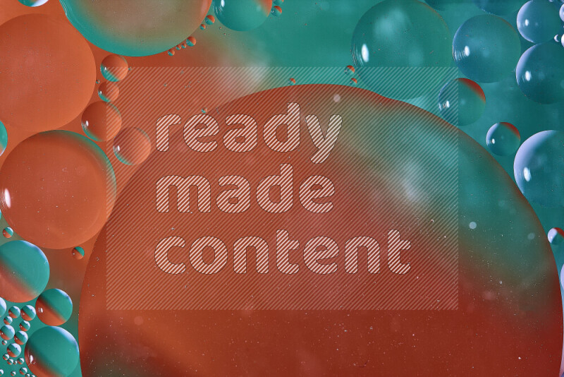 Close-ups of abstract oil bubbles on water surface in shades of green and orange