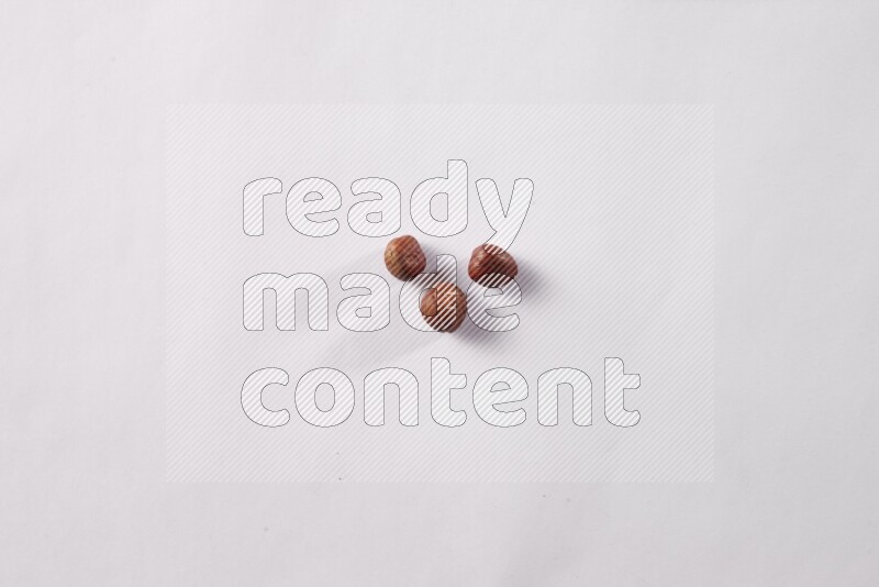 Hazelnuts on white background