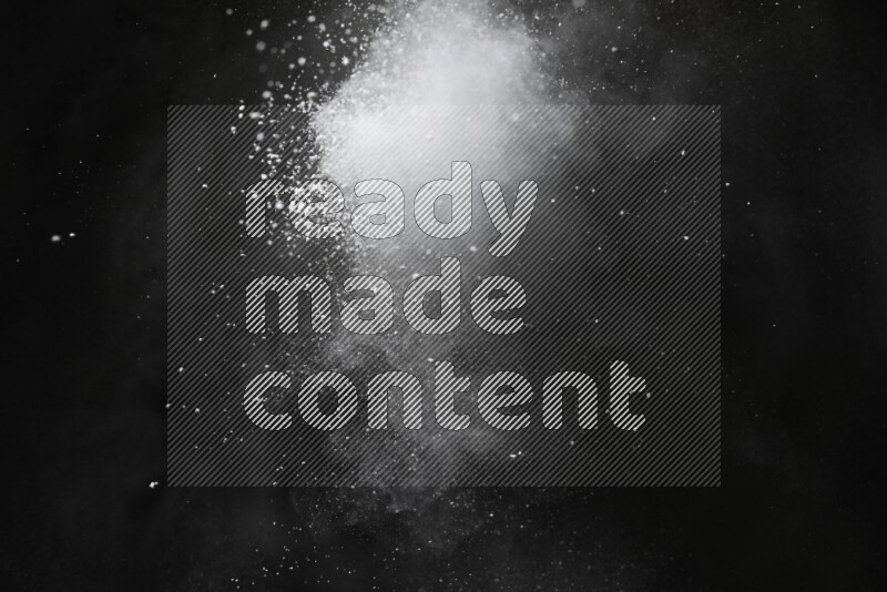 White powder explosion on black background
