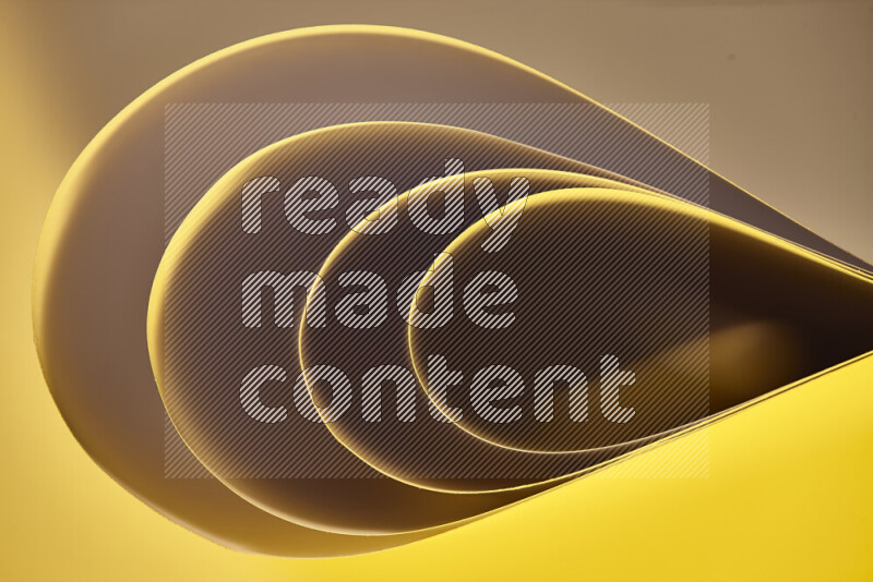 An abstract art of paper folded into smooth curves in gold gradients