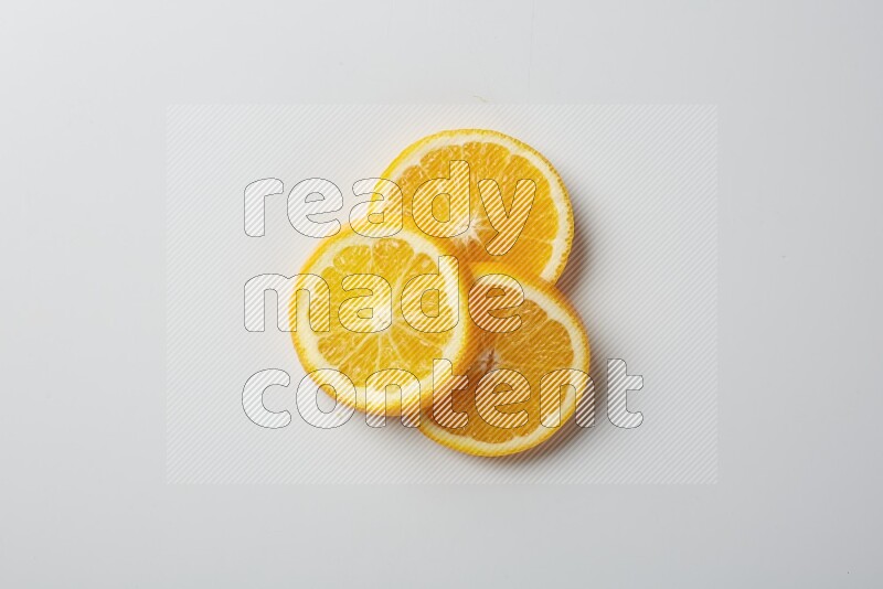 Three orange slices on a white background