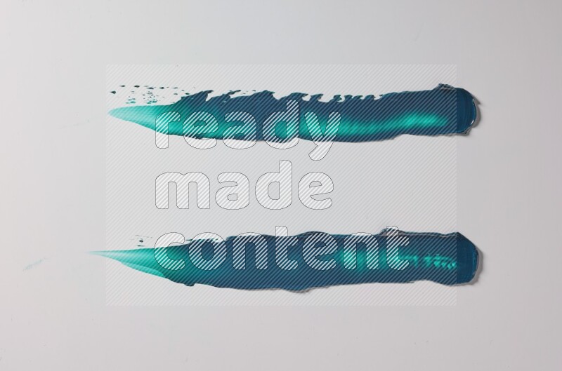 Turquoise painting knife strokes on white background