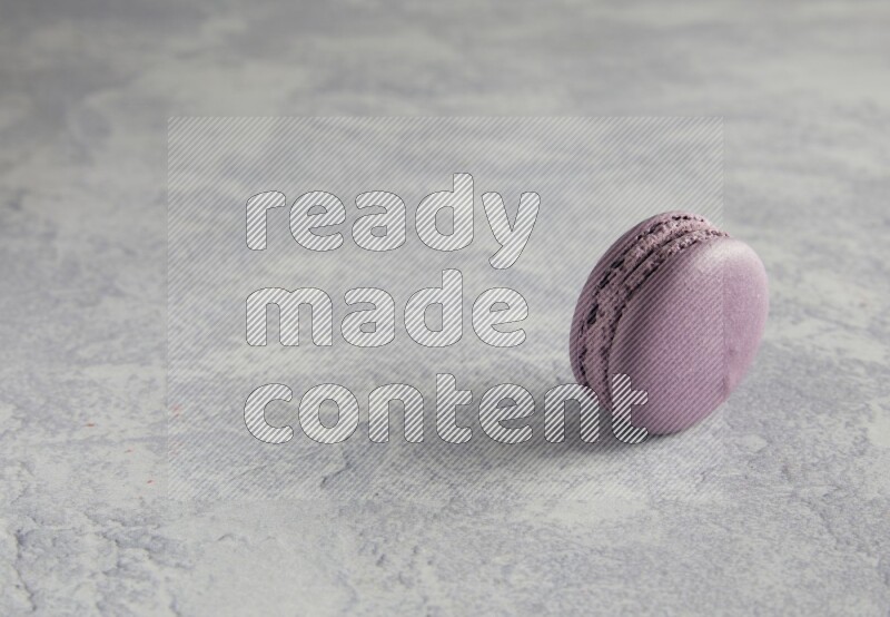 45º Shot of Purple Blueberry macaron on white  marble background