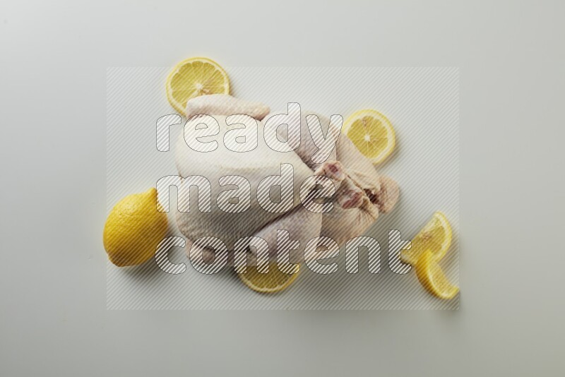 Whole fresh chicken direct on a white background