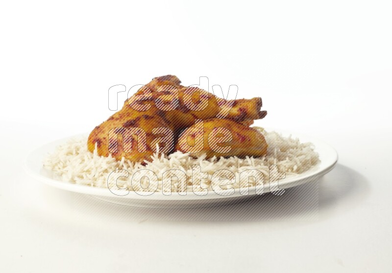 white  basmati Rice with  kabsa chicken pieces  on a white rounded plate direct on white background