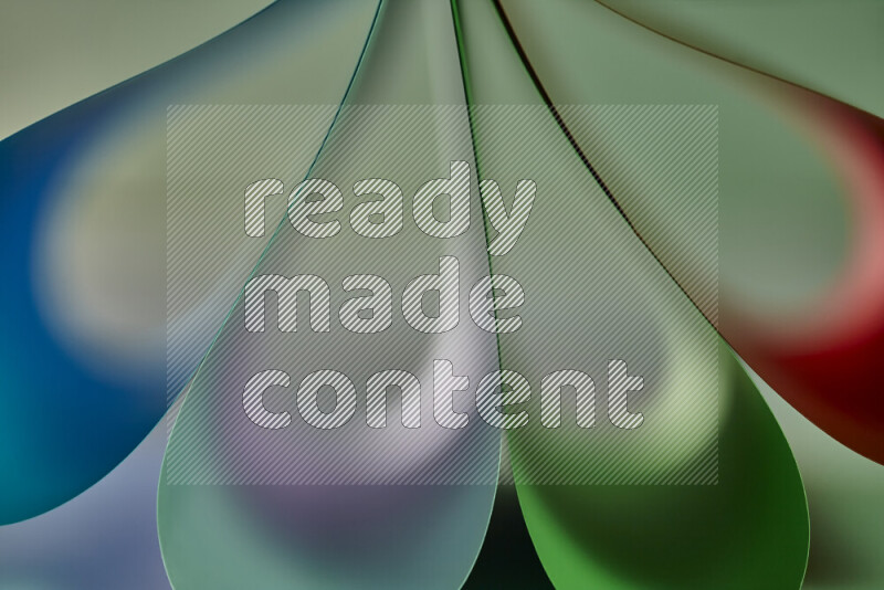 An abstract art piece displaying smooth curves in colorful gradients created by colored light