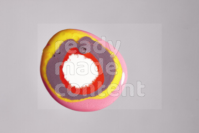 Close-ups of assorted colors blending on a grey background