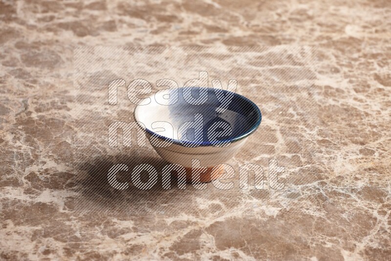 Multicolored Pottery Bowl on Beige Marble Flooring