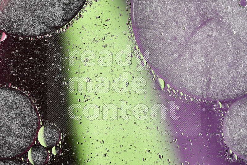 Close-ups of abstract oil bubbles on water surface in shades of green, purple and pink