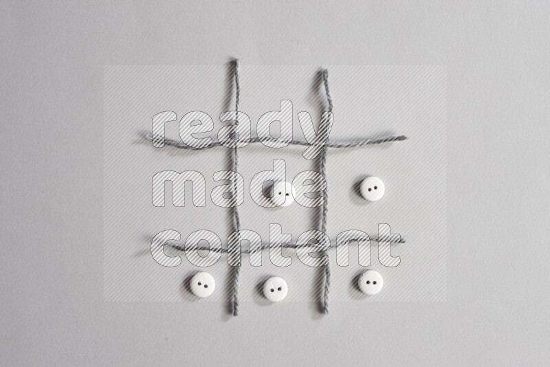 White buttons placed on grey background