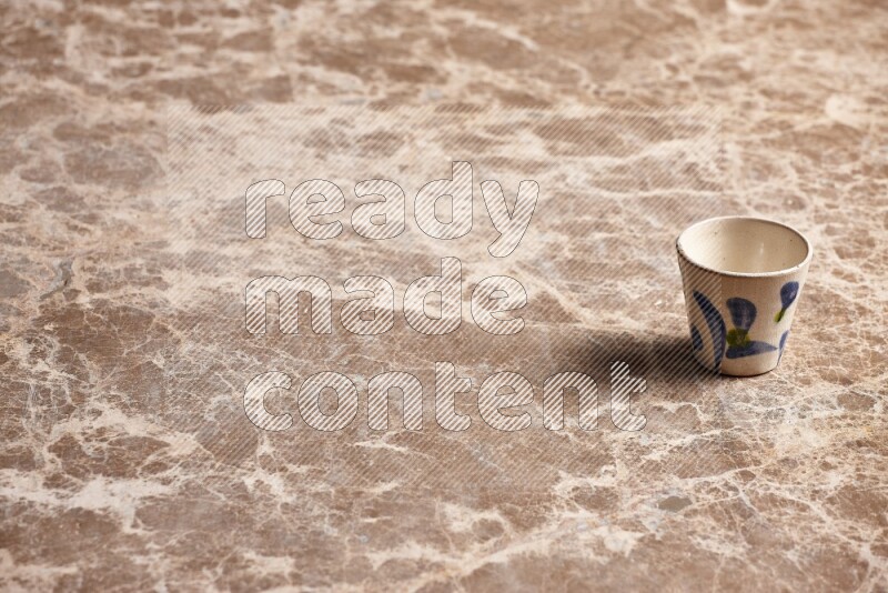 Pottery Cup on Beige Marble Flooring