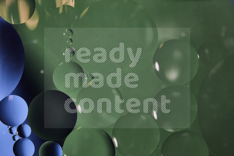 Close-ups of abstract oil bubbles on water surface in shades of blue and green