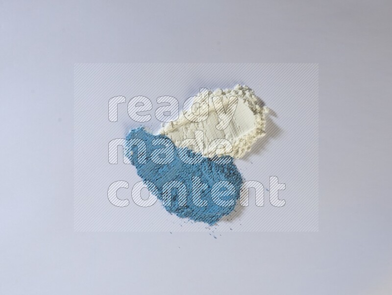 Multicolored powder smears on white background