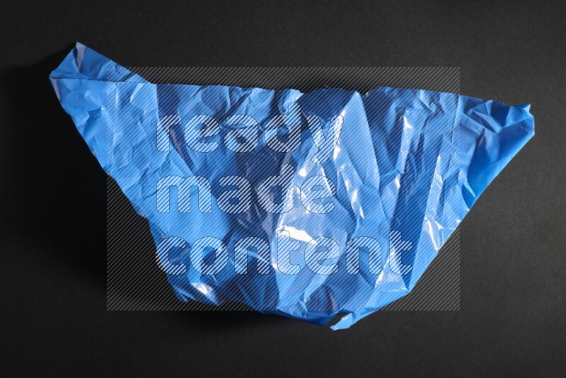 Colored plastic textures on black background