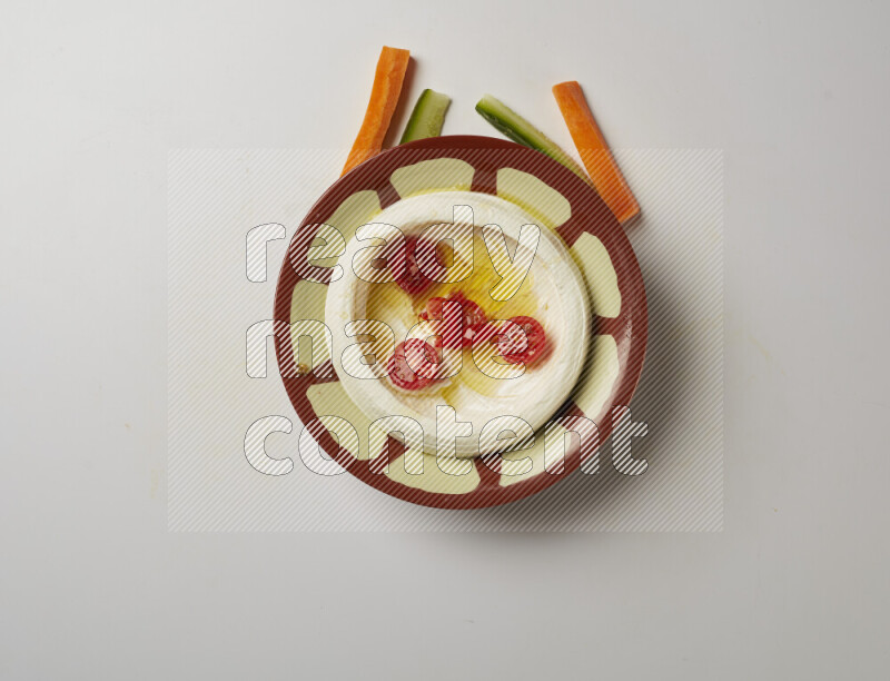 Lebnah garnished with Cherry tomato in a traditional plate on a white background