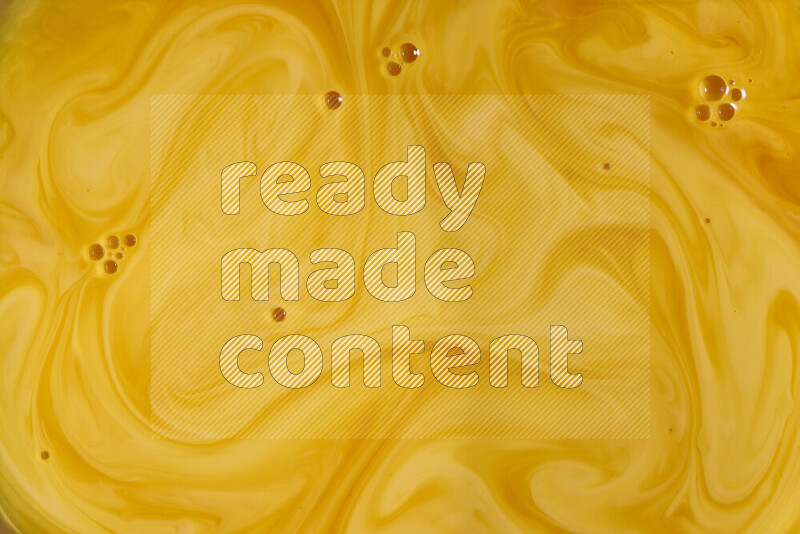 A close-up of abstract different swirling patterns in orange