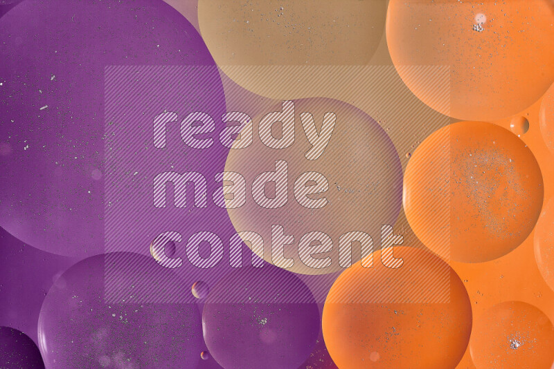 Close-ups of abstract oil bubbles on water surface in shades of brown, orange and purple