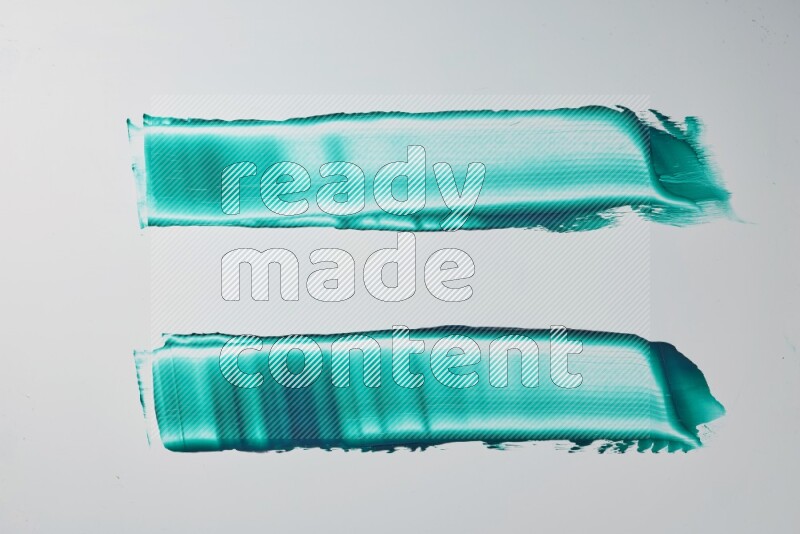 Turquoise painting knife strokes on white background