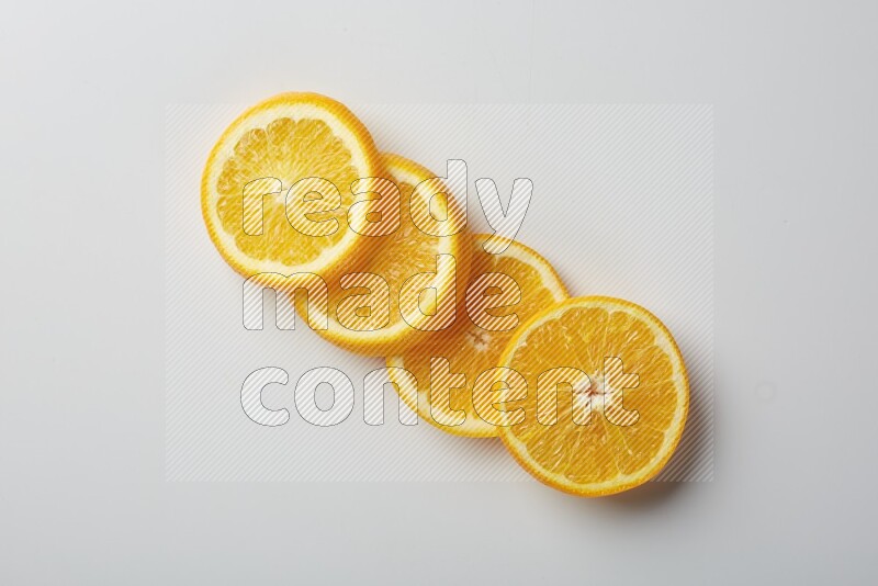 Four orange slices on a white background