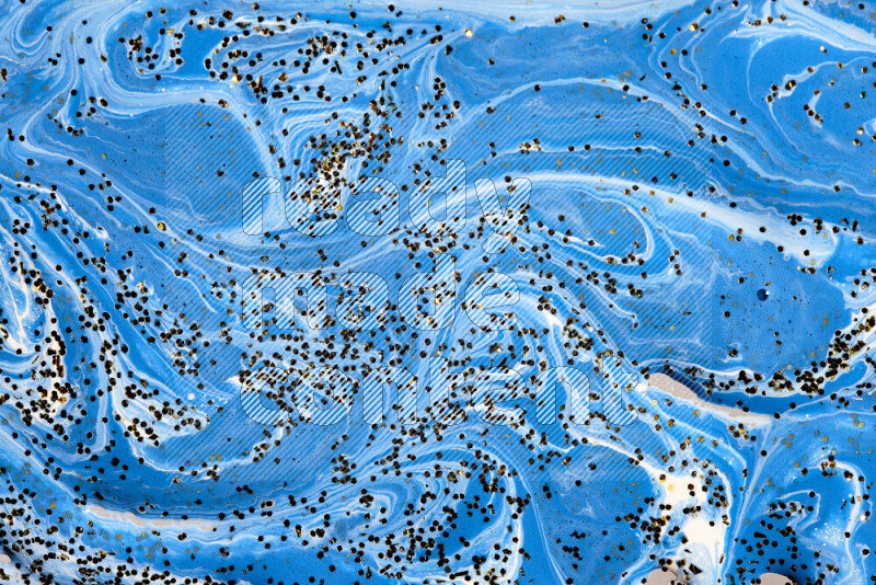 Abstract colorful background with mixed of blue and white paint colors with scattered gold glitter