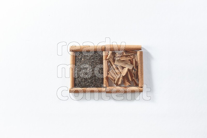2 squares of cinnamon sticks full of black tea and cinnamon on white flooring