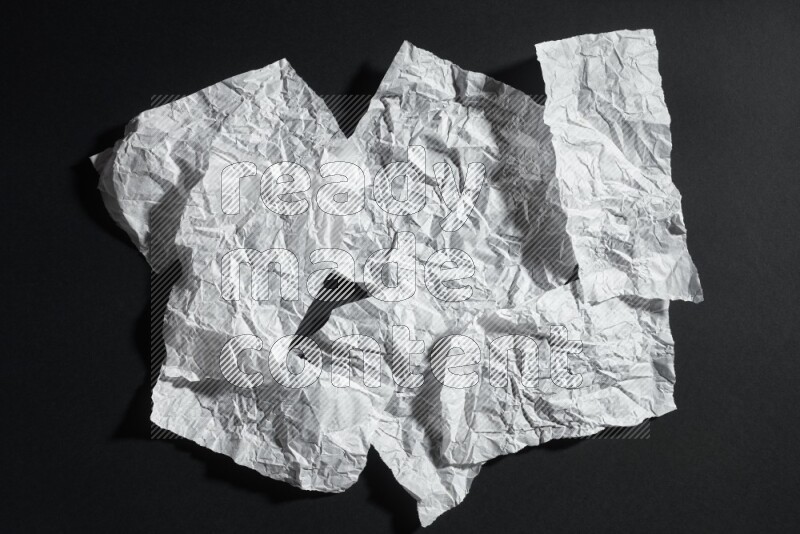 White paper sheet on black background