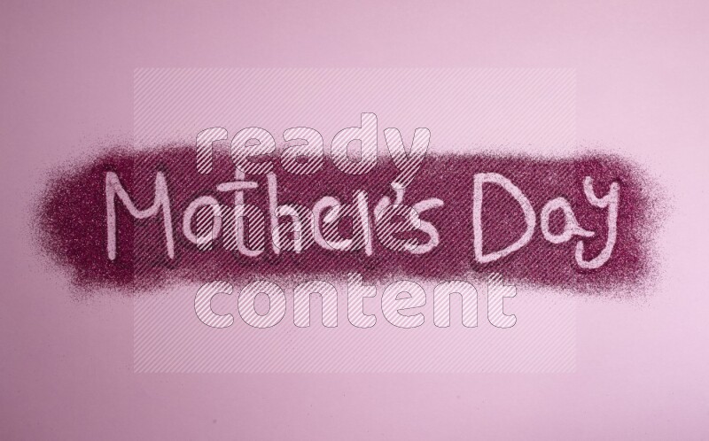 A sentence written with pink glitter on pink background