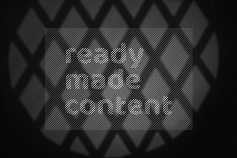 مجموعة من ضوء الغوبو الخافت تظهر أنماط هندسية علي سطح ناعم