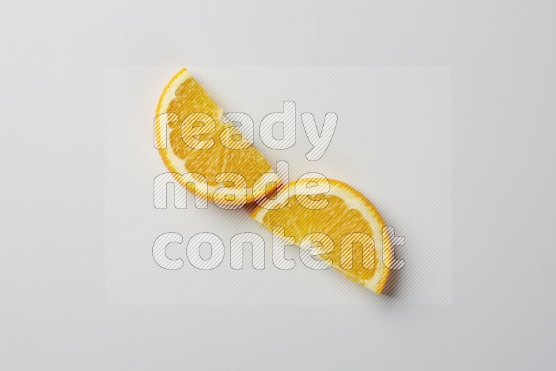 Two halves of an orange slices on white background