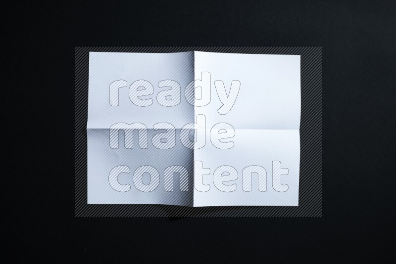 White paper sheet on black background