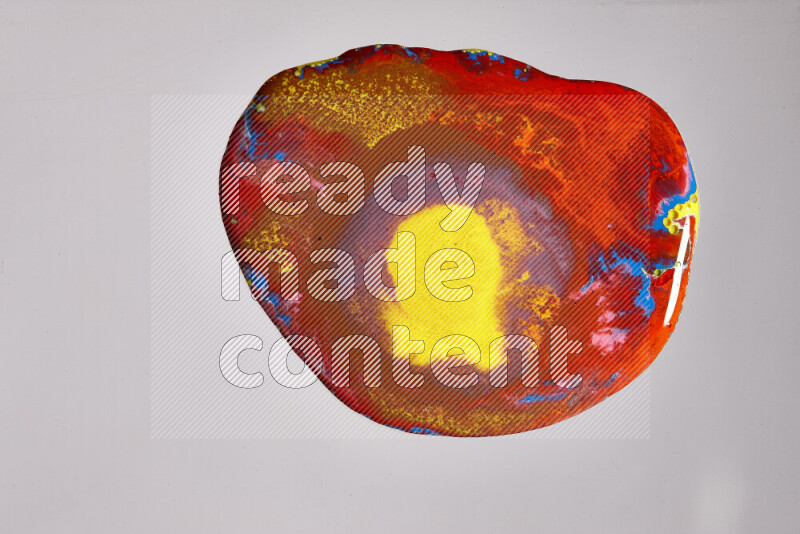 Close-ups of assorted colors blending on a grey background