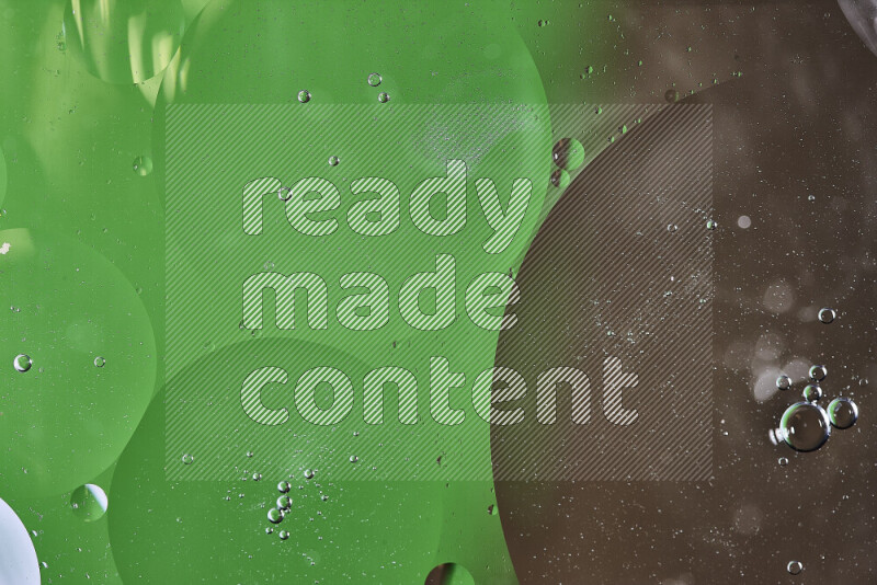 Close-ups of abstract oil bubbles on water surface in shades of green and brown