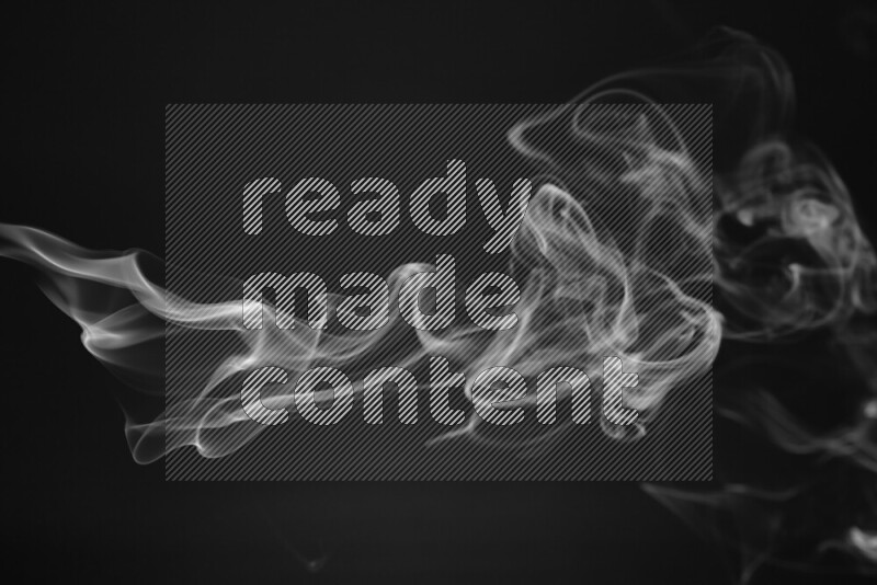 Motion of wavy smoke isolated on dark background